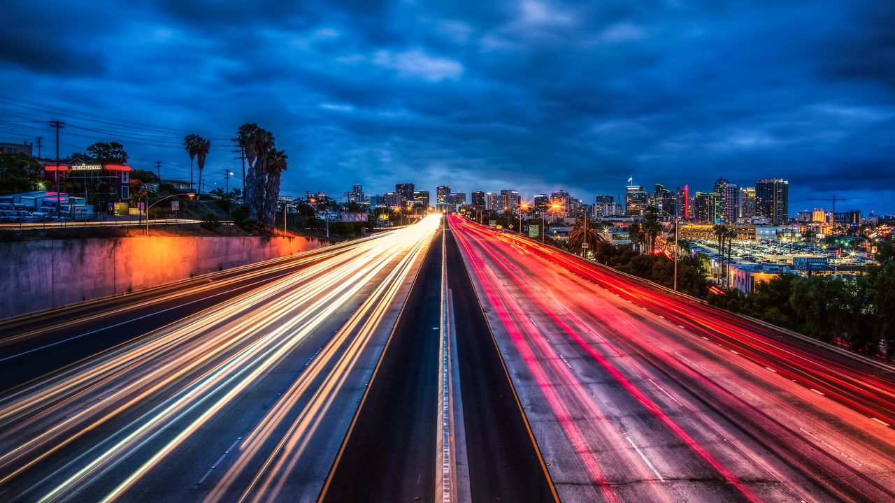 Interstate light trails leading into downtown San Diego at blue hour