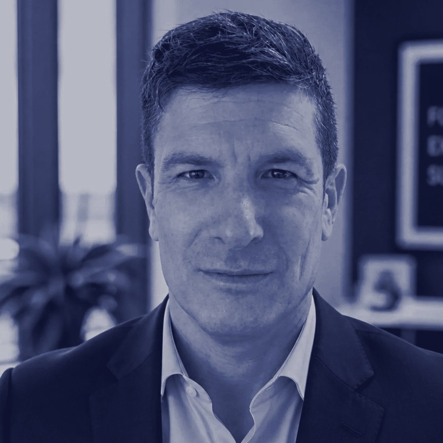 David Perloff, host and creator of PRINCIPALS, in a navy-toned portrait